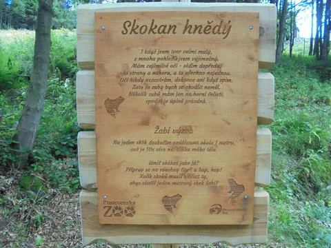 Educational sign about common frog on nature trail in Pustevny forest Stock Photos