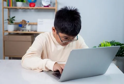 Educational of tech concept, Staying at home, Little Asian boy student usin.. Stock Photos