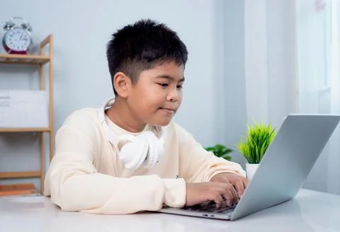 Educational of tech concept, Staying at home, Little Asian boy student usin.. Stock Photos