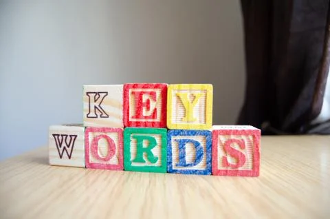 Educational toy cubes with letters organised to display word KEYWORDS - editing Stock-Fotos
