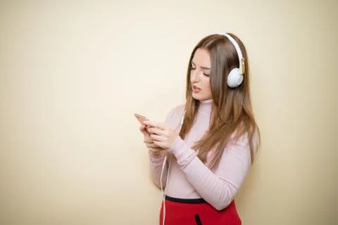 Educative content. Study english language with audio lessons. Girl listen music Stock Photos