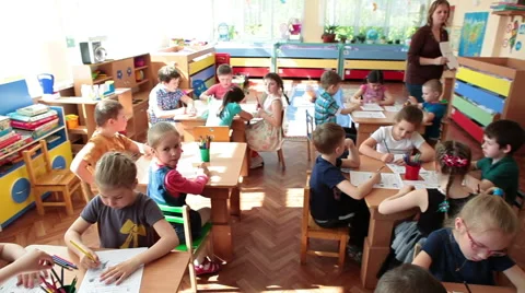 Educators help children to drawing in caycare center at the skill lesson Stock Footage 50870629