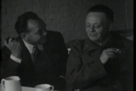 Edward G. Robinson spends time with a military officer and leaves - 1944 Stock Footage 93930651