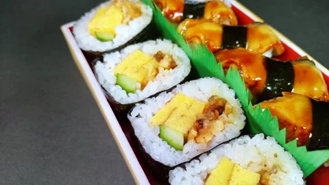 Eel Sushi in a plastic box, rotating Video stock 312126426