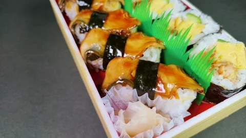 Eel Sushi in a plastic box, rotating Video stock 312533278