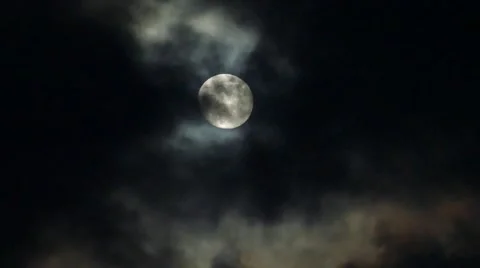 Eerie clouds cover and reveal full moon ... | Stock Video | Pond5