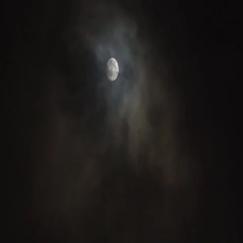 Eerie clouds pass over a super moon. Stock Footage 69671905