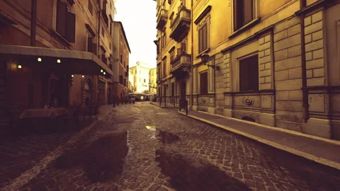Eerie corridor illuminated by lantern light with rugged stone walls Stock Footage 340339161