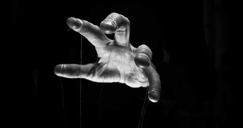 Eerie puppeteer hands controlling you. Manipulation concept Stock Footage