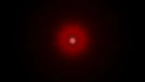 Eerie red light emanating from darkness creating a powerful focal point for イラスト素材