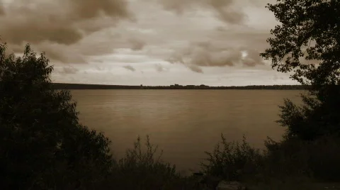 Eerie Sepia-tone Clouds over Water Stock Footage