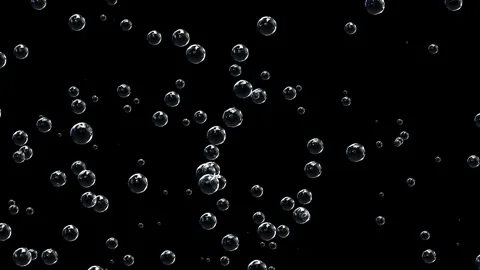 The effect of carbonated drink. Rising bubbles in a dark space. Stock Footage 318588080