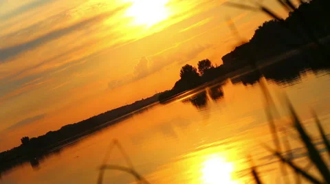 The effect of the flight chamber. Mirror reflection of the sunset in the water. Stock Footage 40737606