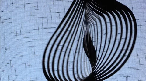 Effect of a hypnotic black metallic object rotating on azure background Video stock 51231578