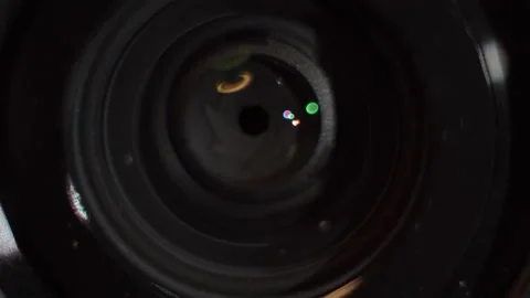 The effect of light reflection on the surface of the camera lens 스톡 동영상 205583613