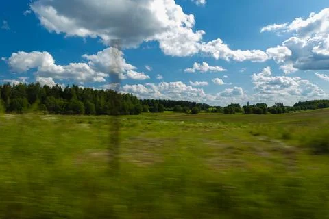 The effect of speed on the road and blur. Roadside view, road and landscape. Stock Photos