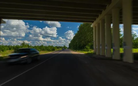 The effect of speed on the road and blurred objects. View of the road. 写真素材