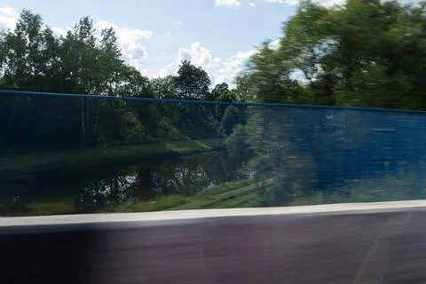 The effect of speed on the road and blurred objects. Roadside view and landscape Stock Photos