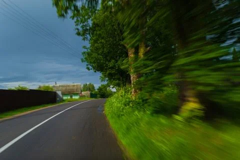 The effect of speed on the road and blurred objects. View of the road Stock Photos