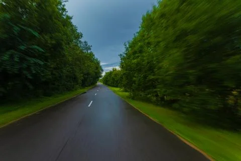 The effect of speed on the road. View of the road on a sunny summer day. Stockfoto's