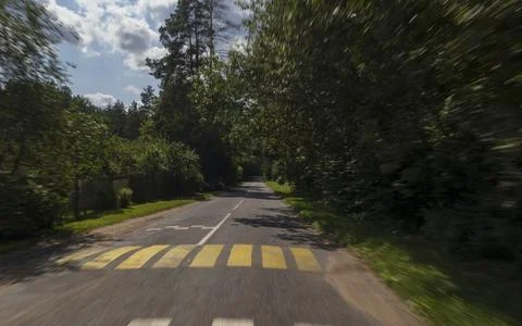 The effect of speed on the road. View of the road on a sunny summer day. Stock-Fotos
