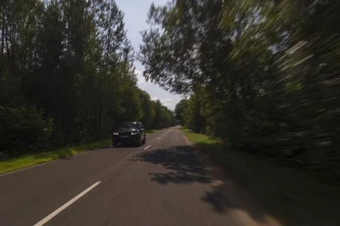 The effect of speed on the road. View of the road on a sunny summer day. Фото