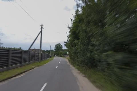 The effect of speed on the road. View of the road on a sunny summer day. 库存照片