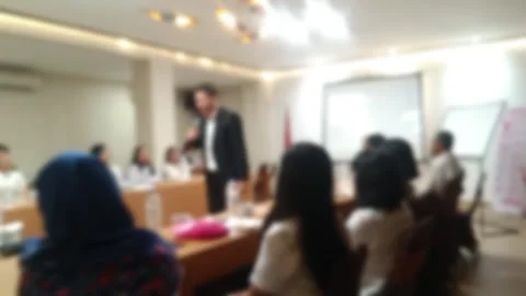 Effect video of Dynamic presentation with a speaker interacting with an engaged Stock Footage 340533807