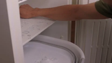 Effective and Efficient Ice Management Strategies for Your Home Freezer Space Stock Footage 312647432