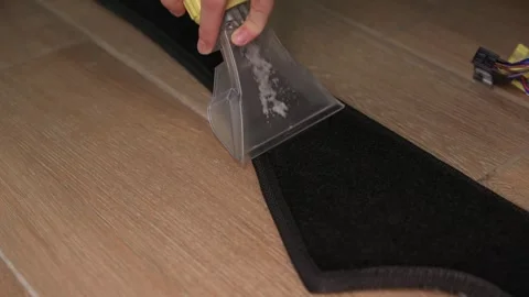 Effective Cleaning of Carpet using a Scraper Tool combined with a Solutions for Stock Footage 317290951