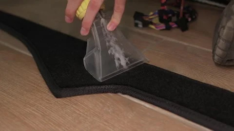 Effective Cleaning of Carpet using a Scraper Tool combined with a Solutions for Stock Footage 317291001