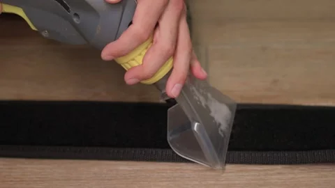 Effective Cleaning of Carpet using a Scraper Tool combined with a Solutions for Stock Footage 317291009