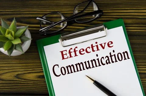EFFECTIVE COMMUNICATION - words on a white sheet on a brown wooden backgrou.. Stock Photos