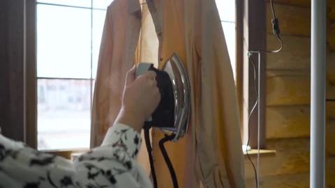 Effective smoothing of clothes with steam. Technology for smoothing clothes with Stock Footage 160835378