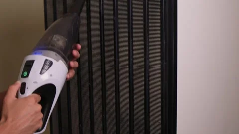 Effectively cleaning an refrigerator Unit using a vacuum is essential for Stock Footage 312647590
