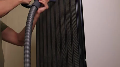 Effectively cleaning an refrigerator Unit using a vacuum is essential for Stock Footage 312647616