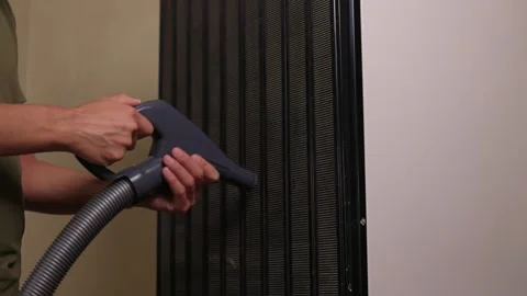 Effectively cleaning an refrigerator Unit using a vacuum is essential for Stock Footage 312647631
