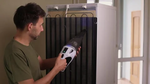 Effectively cleaning an refrigerator Unit using a vacuum is essential for Stock Footage 312647837