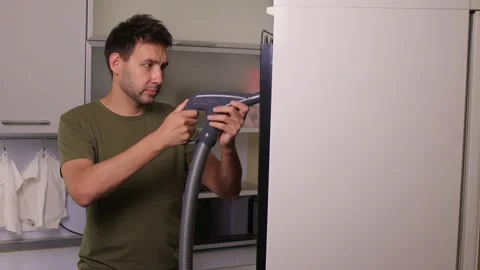 Effectively cleaning an refrigerator Unit using a vacuum is essential for Stock Footage 312647857