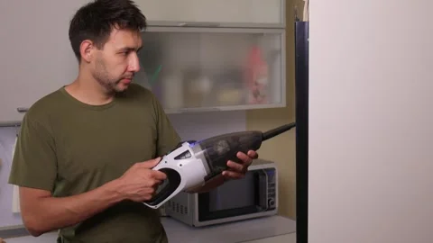 Effectively cleaning an refrigerator Unit using a vacuum is essential for Stock Footage 312647860