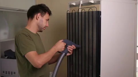 Effectively cleaning an refrigerator Unit using a vacuum is essential for Stock Footage 312647907