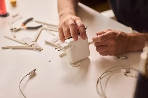 Effectively Organizing and Skillfully Managing Tech Cables for a Neater and Tidy Stock Photos