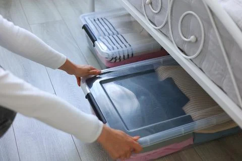 Effectively Organizing and Storing Clothes Under the Bed Using Clear Storage Stock Photos