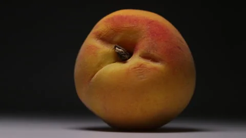 Effects of light and shadow on a peach Stock Footage 136912084