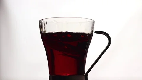 Effects of a slice of lemon thrown into the boiling hot punch Stock Footage 87234406