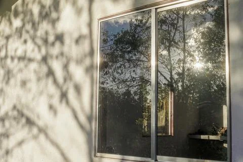 Effects of the sunlight on a wall and a window Stock Photos