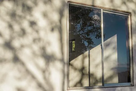 Effects of the sunlight on a wall and a window Foto stock