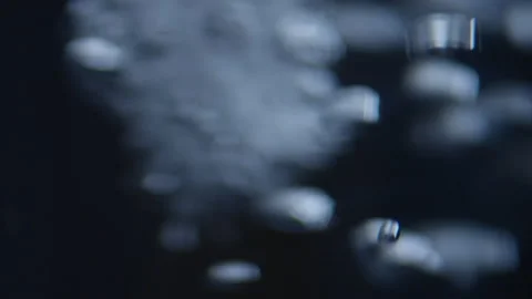 Effervescent air bubbles shake and move in the water at high speed Stock Footage 229748868