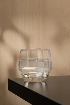 Effervescent mucolytic tablet dissolves in water. Stock Photos
