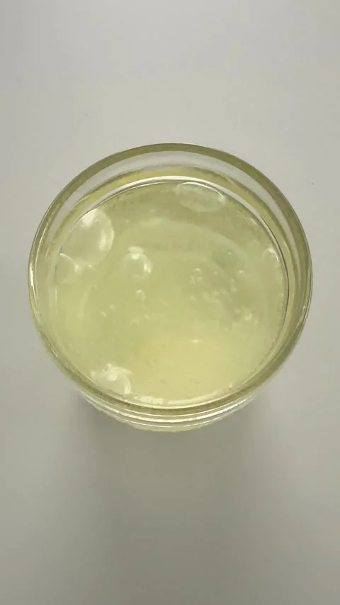 Effervescent multi vitamin tablet dissolving in glass of water Stock Footage 309285823